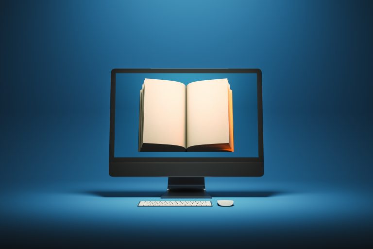 Open book inside a computer monitor on a blue background representing digital learning, e-books, and online education platforms.