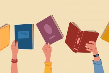 Diverse hands holding books.